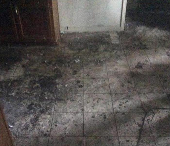 the debris removed, showing the tile floor ready to clean