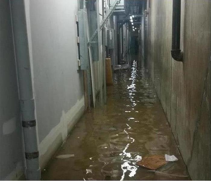 Industrial hallway with standing water  