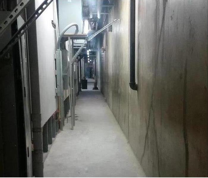Industrial hallway with flood cut sheetrock   