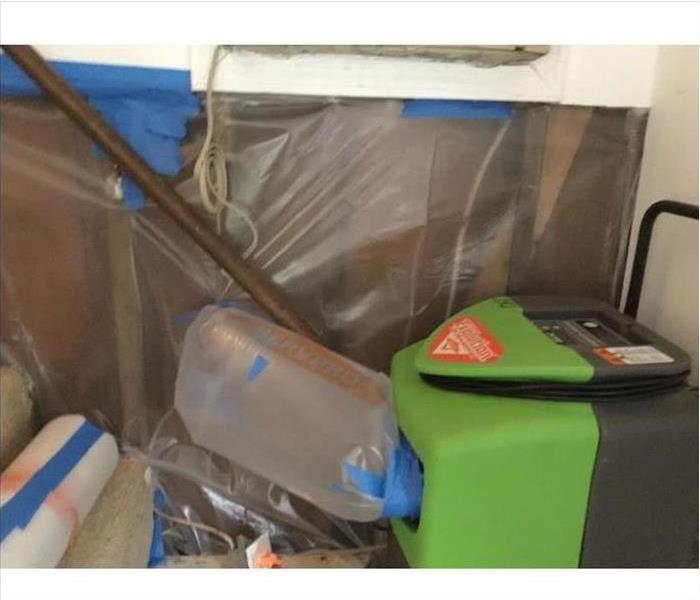 SERVPRO drying equipment and plastic barriers 
