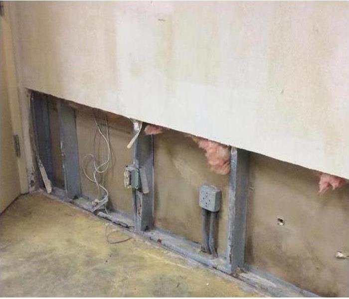 Wall with interior exposed with electrical outlets