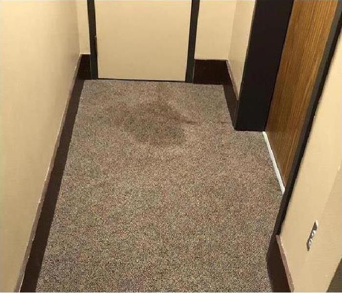 Office doorway with wet carpet  