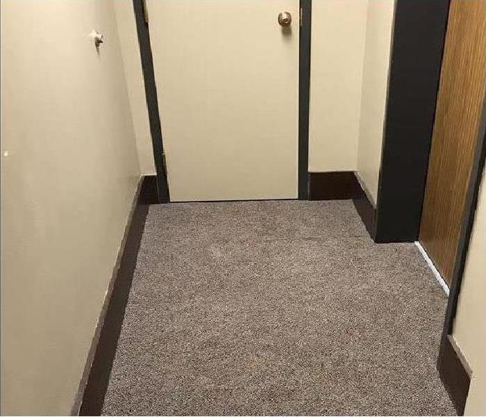 Office doorway with gray carpet