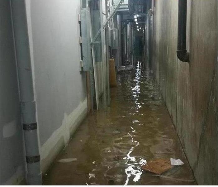 Warehouse hallway with standing water