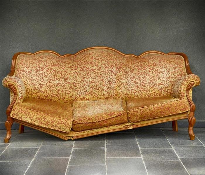 golden sofa with a broken frame